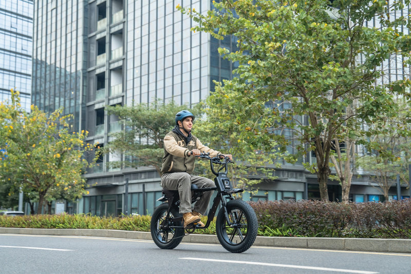 Rider using a black TXED electric bike on an urban street
