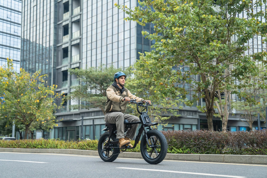 Rider using a black TXED electric bike on an urban street