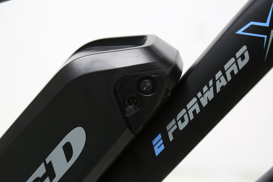 TXED Trail frame-mounted battery switch and charging port close-up