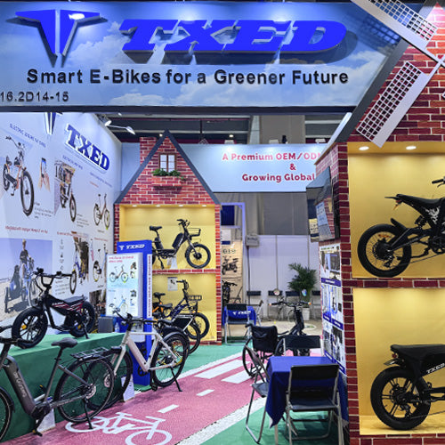 TXED exhibition stand displaying electric bikes beneath the brand sign.