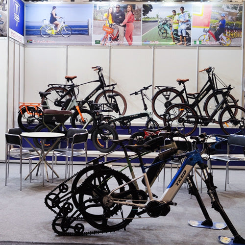 TXED electric bike display and meeting area at an exhibition.